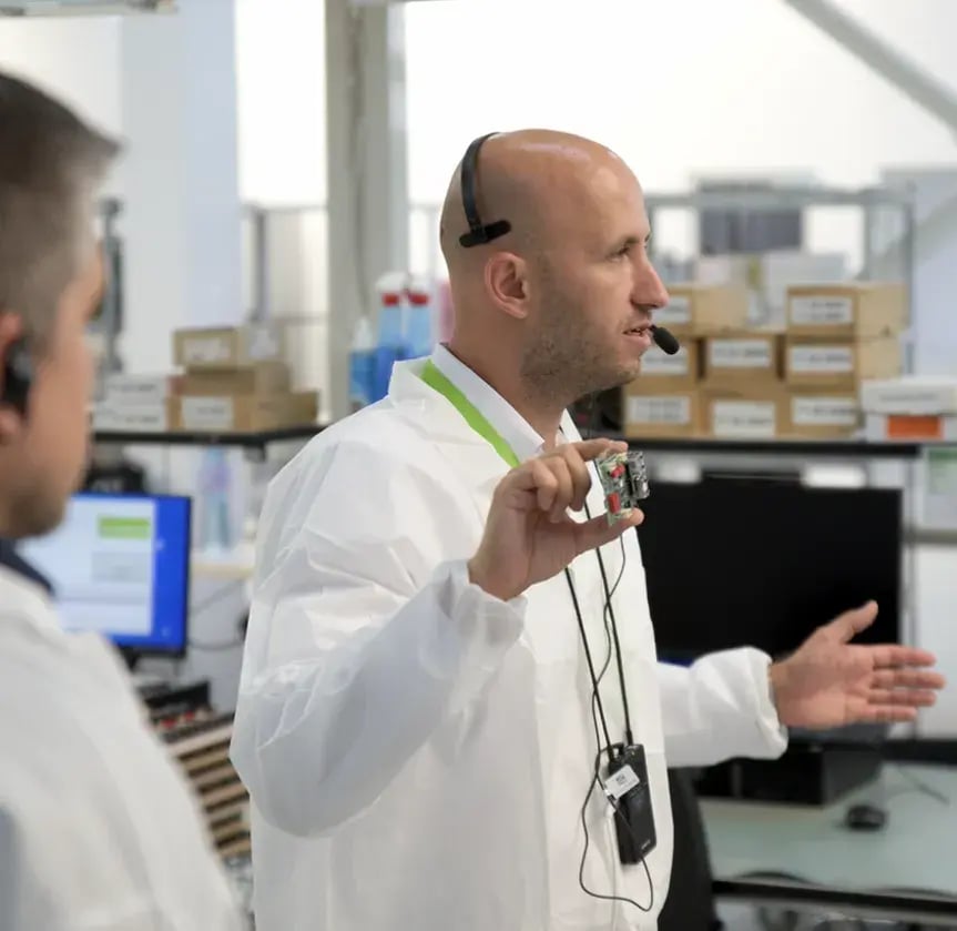 people-wearing-white-and-headsets-in-lab
