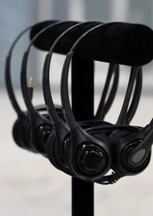 Headsets sitting on a stand