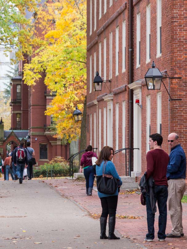 students-talking-on-campus-sidewalk