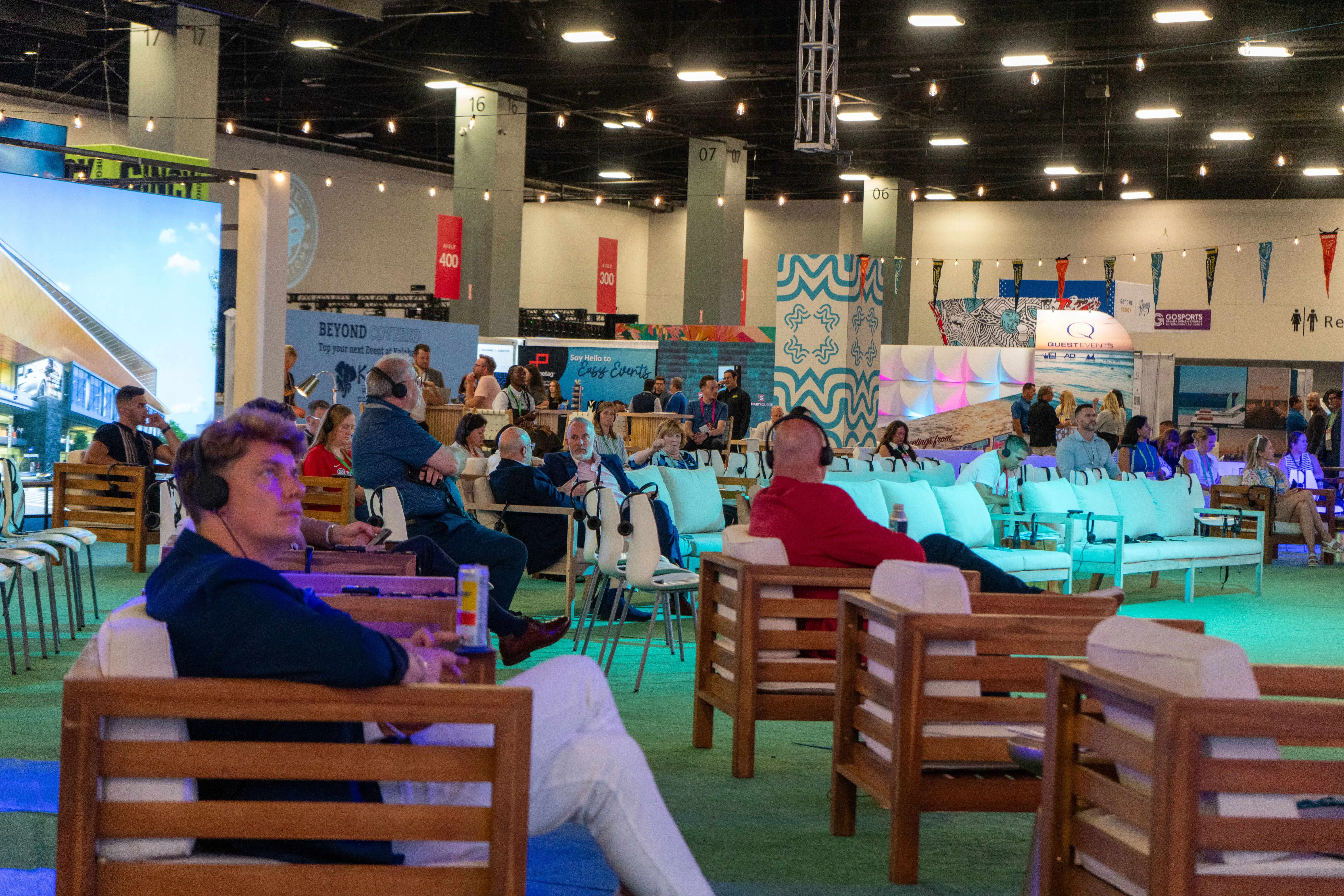 People using headsets to listen to a speaker